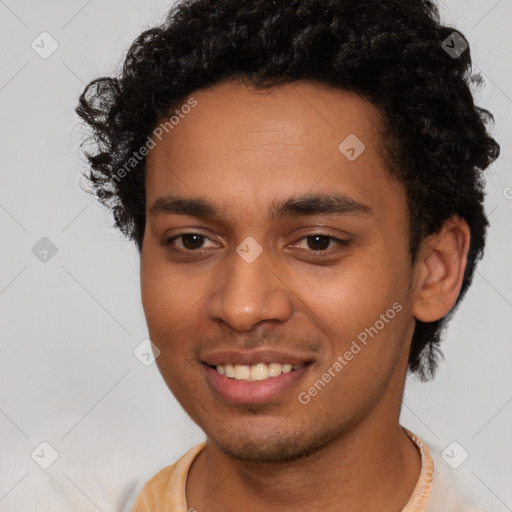 Joyful latino young-adult male with short  brown hair and brown eyes