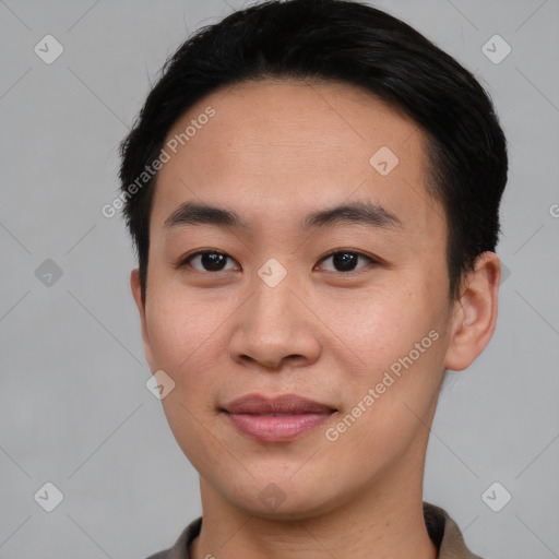 Joyful asian young-adult male with short  brown hair and brown eyes