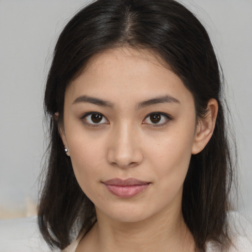 Neutral asian young-adult female with medium  brown hair and brown eyes