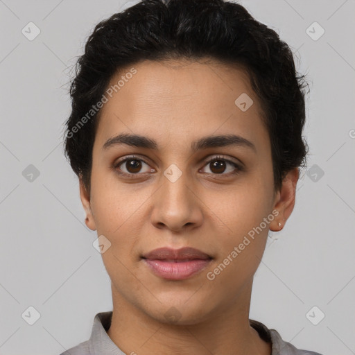 Joyful latino young-adult female with short  black hair and brown eyes