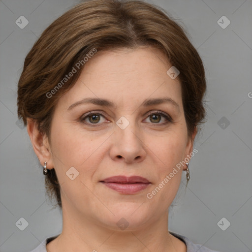 Joyful white adult female with medium  brown hair and grey eyes