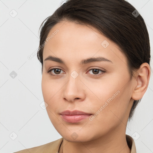 Neutral white young-adult female with long  brown hair and brown eyes