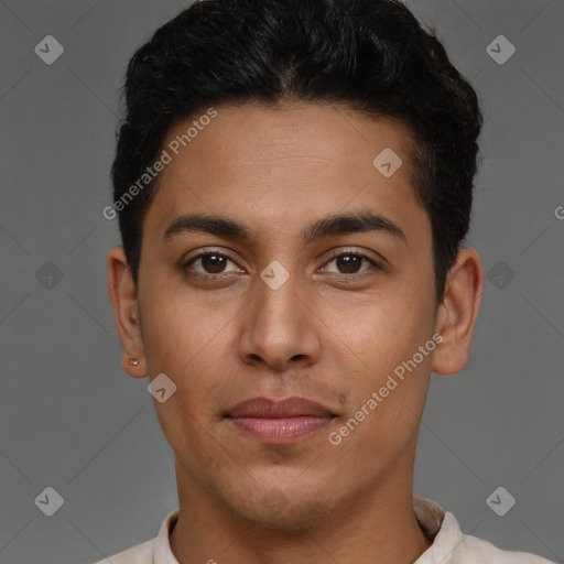 Joyful latino young-adult male with short  brown hair and brown eyes