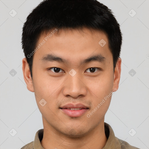 Joyful asian young-adult male with short  black hair and brown eyes