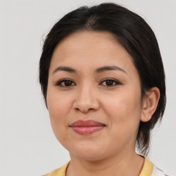 Joyful asian young-adult female with medium  brown hair and brown eyes