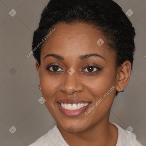 Joyful black young-adult female with short  brown hair and brown eyes