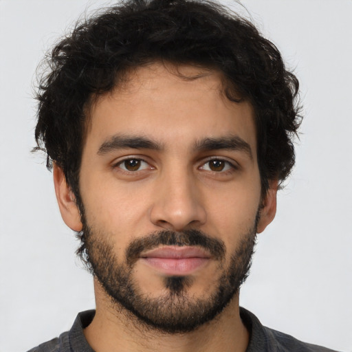 Neutral latino young-adult male with short  brown hair and brown eyes