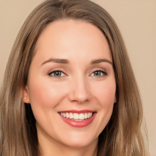 Joyful white young-adult female with long  brown hair and brown eyes