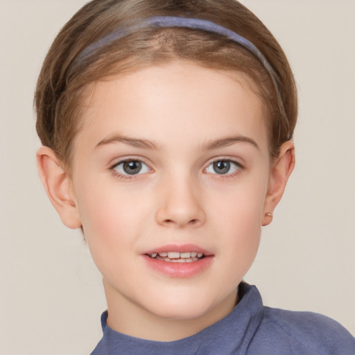 Joyful white child female with short  brown hair and brown eyes