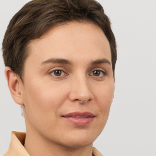 Joyful white young-adult female with short  brown hair and brown eyes