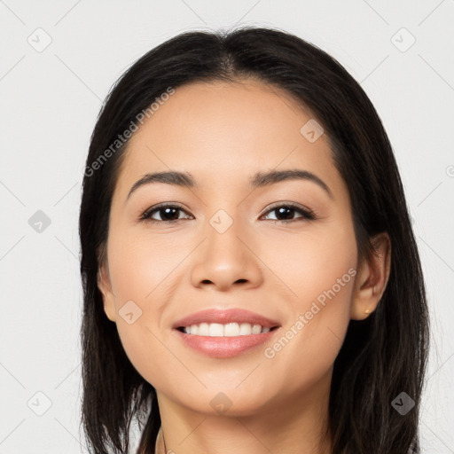 Joyful latino young-adult female with long  black hair and brown eyes