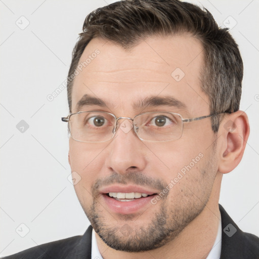 Joyful white adult male with short  brown hair and brown eyes