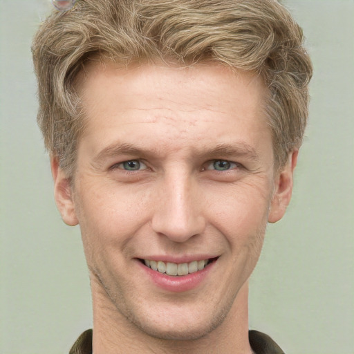 Joyful white adult male with short  brown hair and grey eyes