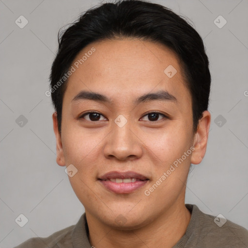 Joyful asian young-adult male with short  black hair and brown eyes