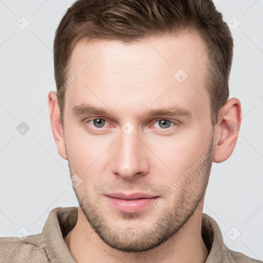 Neutral white young-adult male with short  brown hair and grey eyes