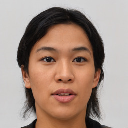 Joyful asian young-adult female with medium  black hair and brown eyes