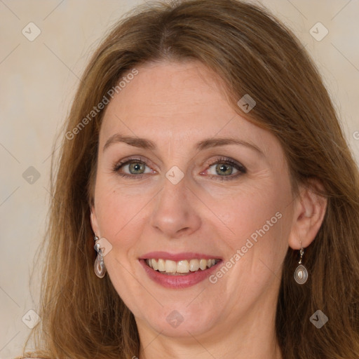 Joyful white adult female with long  brown hair and grey eyes