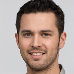 Joyful white young-adult male with short  brown hair and brown eyes