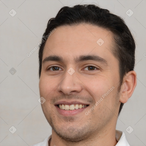 Joyful white young-adult male with short  black hair and brown eyes