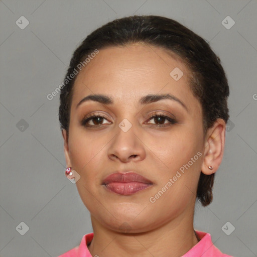 Joyful latino young-adult female with short  brown hair and brown eyes