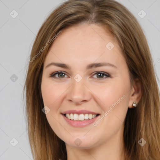 Joyful white young-adult female with long  brown hair and brown eyes