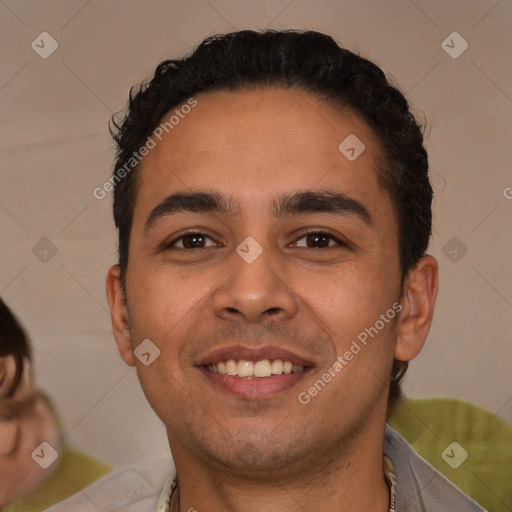 Joyful latino young-adult male with short  brown hair and brown eyes