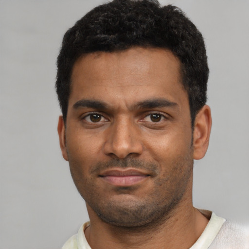Neutral black young-adult male with short  black hair and brown eyes