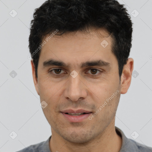 Joyful white young-adult male with short  black hair and brown eyes