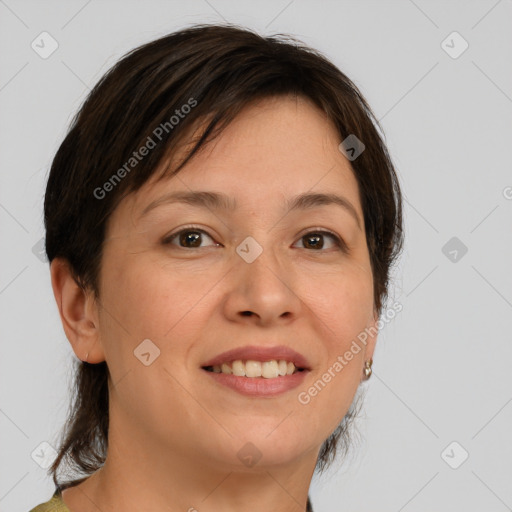 Joyful white adult female with medium  brown hair and brown eyes