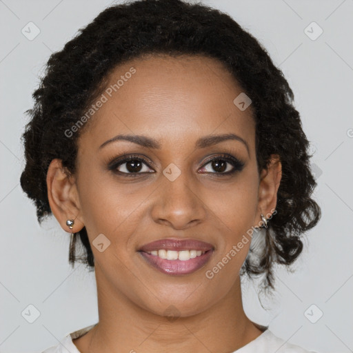 Joyful black young-adult female with short  brown hair and brown eyes