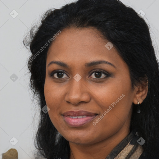 Joyful black young-adult female with long  brown hair and brown eyes