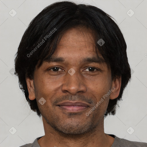 Joyful black adult male with short  black hair and brown eyes