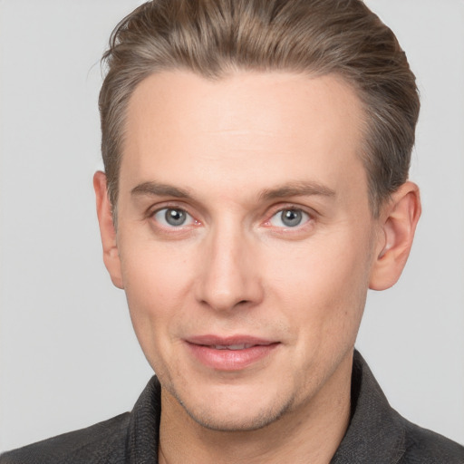 Joyful white adult male with short  brown hair and grey eyes