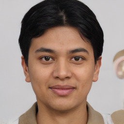 Joyful white young-adult male with short  black hair and brown eyes