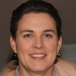 Joyful white adult female with short  brown hair and brown eyes