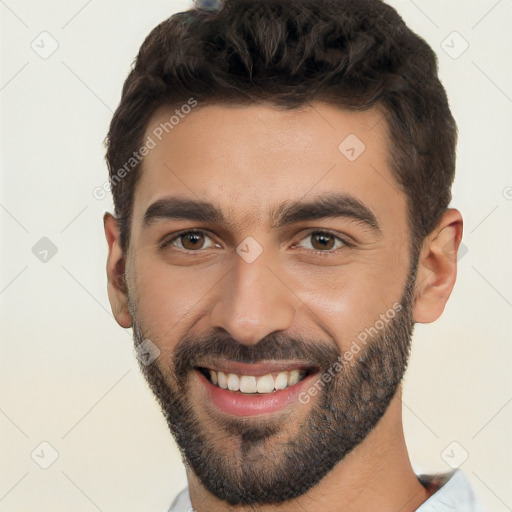 Joyful white young-adult male with short  black hair and brown eyes