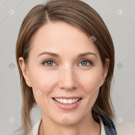 Joyful white young-adult female with medium  brown hair and blue eyes