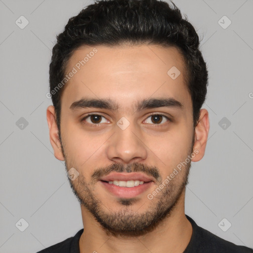 Joyful white young-adult male with short  black hair and brown eyes