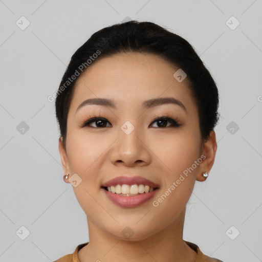 Joyful asian young-adult female with short  black hair and brown eyes