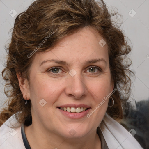 Joyful white adult female with medium  brown hair and blue eyes