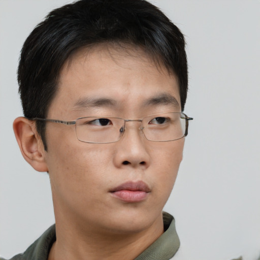 Neutral asian young-adult male with short  brown hair and brown eyes