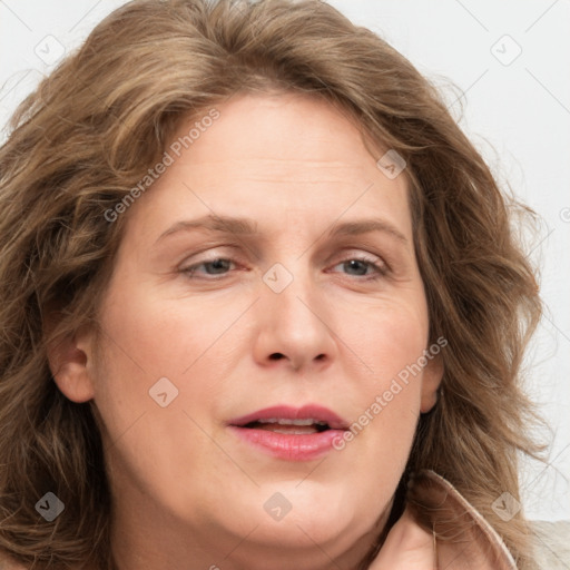 Joyful white adult female with long  brown hair and brown eyes