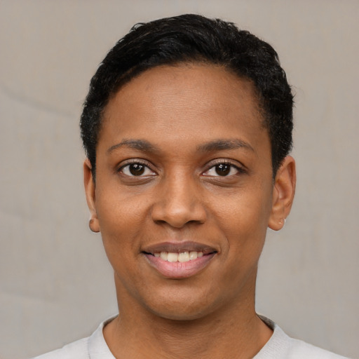 Joyful black young-adult female with short  black hair and brown eyes