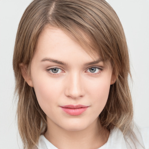 Neutral white young-adult female with medium  brown hair and grey eyes