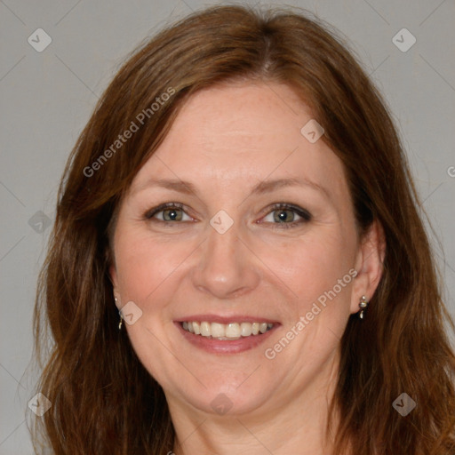 Joyful white adult female with long  brown hair and brown eyes