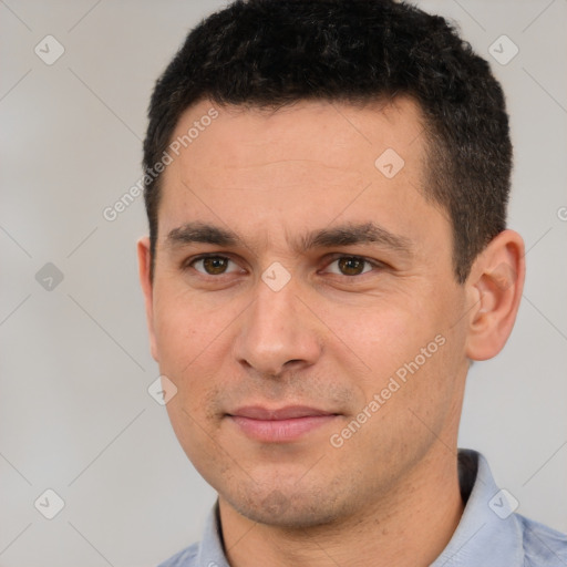 Joyful white young-adult male with short  black hair and brown eyes