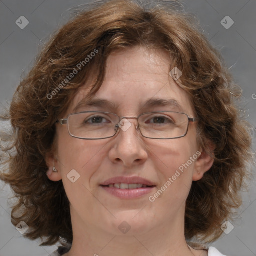 Joyful white adult female with medium  brown hair and blue eyes