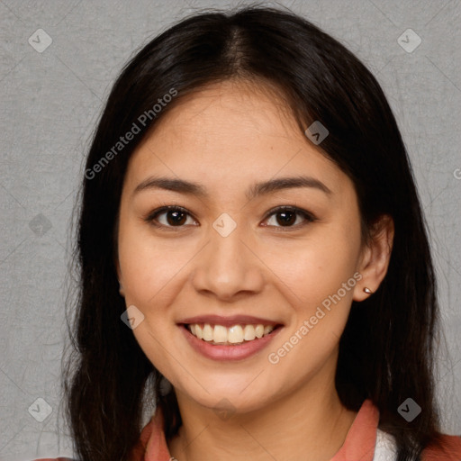 Joyful asian young-adult female with long  brown hair and brown eyes