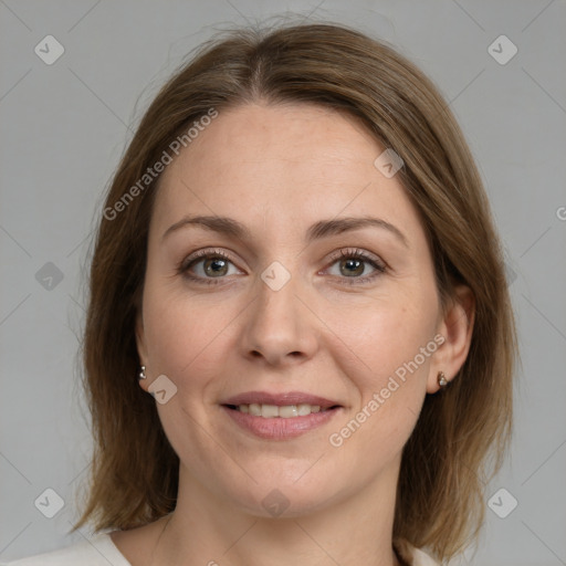 Joyful white adult female with medium  brown hair and grey eyes