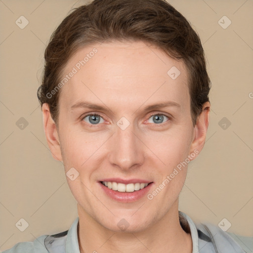 Joyful white young-adult female with short  brown hair and grey eyes